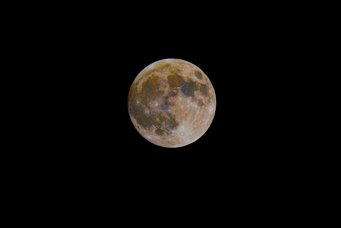 Colour-enhanced close-up of the full Moon with different areas in blue and orange Colour-enhanced close-up of the full Moon with different areas in blue and orange