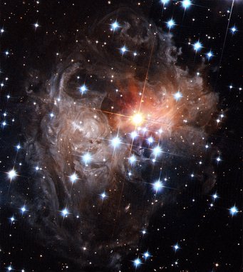 The reddish star V838 Monocerotis in September 2006 surrounded by greyish dust shreds, plus additional foreground stars The reddish star V838 Monocerotis in September 2006 surrounded by greyish dust shreds, plus additional foreground stars