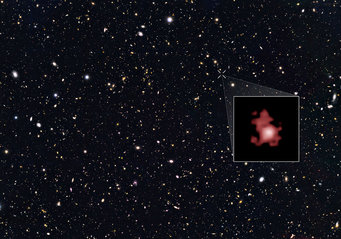The Great Observatories Origins Deep Survey (GOODS) North survey: a deep-exposure image of countless distant galaxies with a cropped magnification of an irregularly shaped reddish spot The Great Observatories Origins Deep Survey (GOODS) North survey: a deep-exposure image of countless distant galaxies with a cropped magnification of an irregularly shaped reddish spot