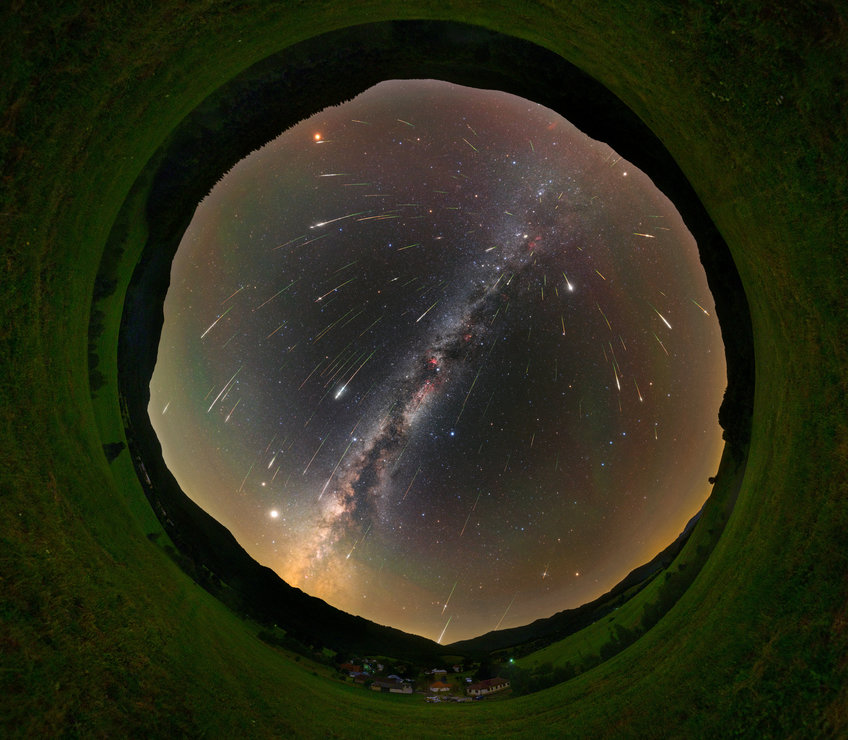 All-sky fisheye image with long exposure time during the Perseids 2021. The night sky with the Milky Way in a fisheye view, many shooting stars seem to come from a spot to the upper right of the image center